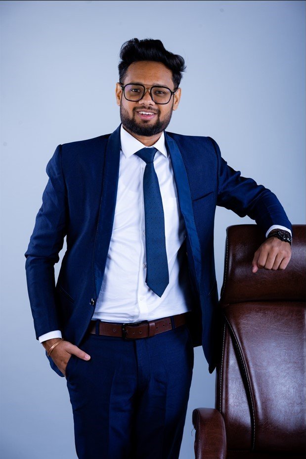 Naman Nandurkar, Founder and CEO of Octmi, seated in an armchair for a corporate portrait in Pune