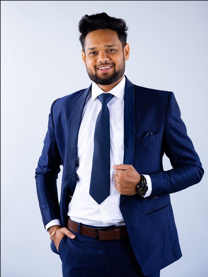 Naman Nandurkar, Founder and CEO of Octmi, in a formal corporate suit portrait in Pune