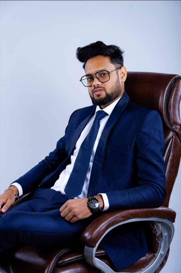 Naman Nandurkar, Founder and CEO of Octmi, seated in an executive chair during a studio portrait session