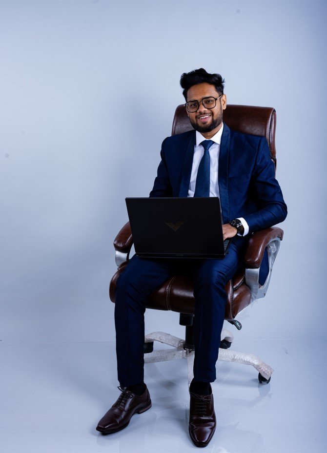 Naman Nandurkar, software engineer and Founder of Octmi, working on a laptop in a chair